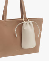 Tote bag with a small pouch attached to the handle.