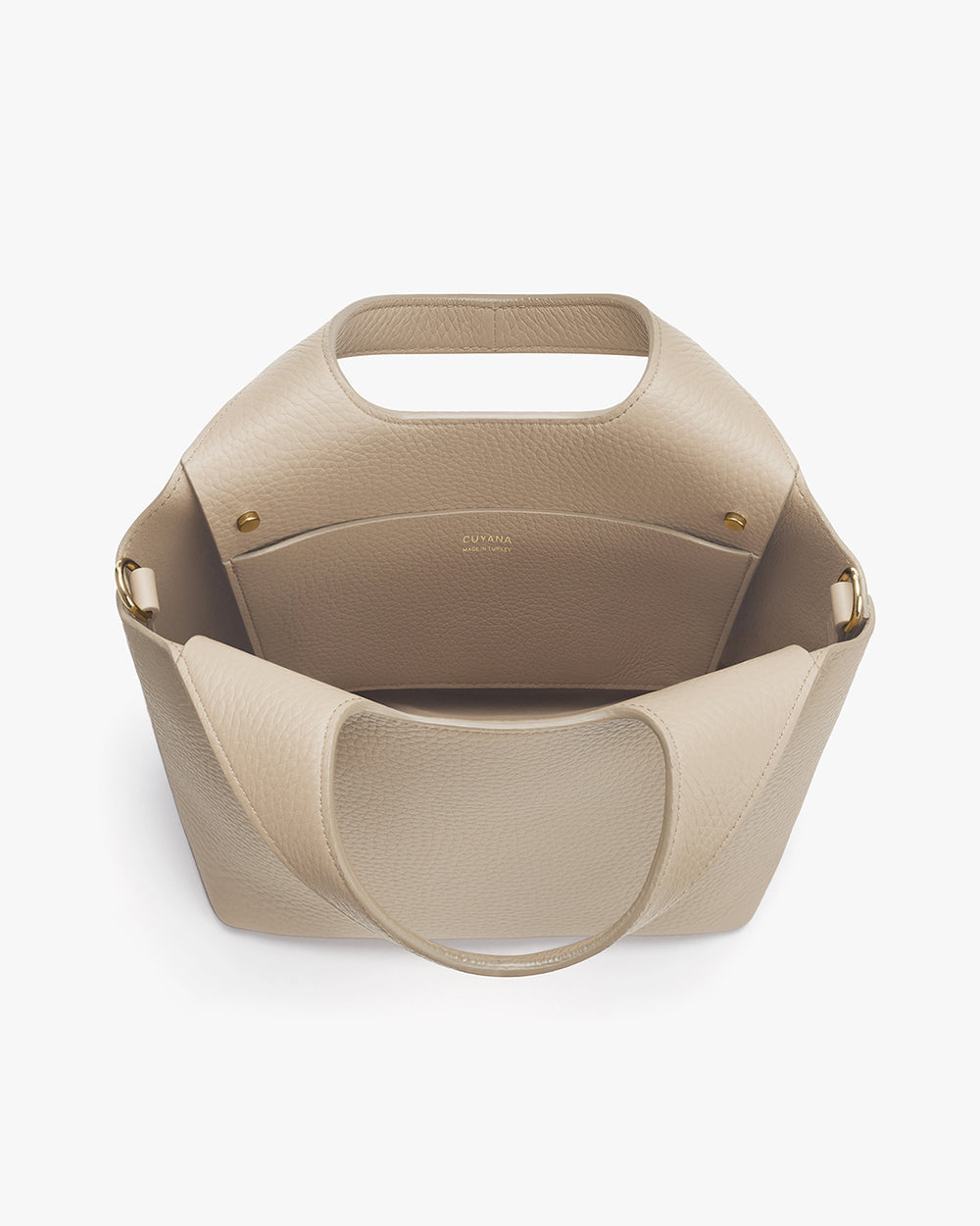 Open handbag with a wide handle and a spacious interior pocket.