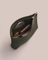 Open pouch with cosmetics inside