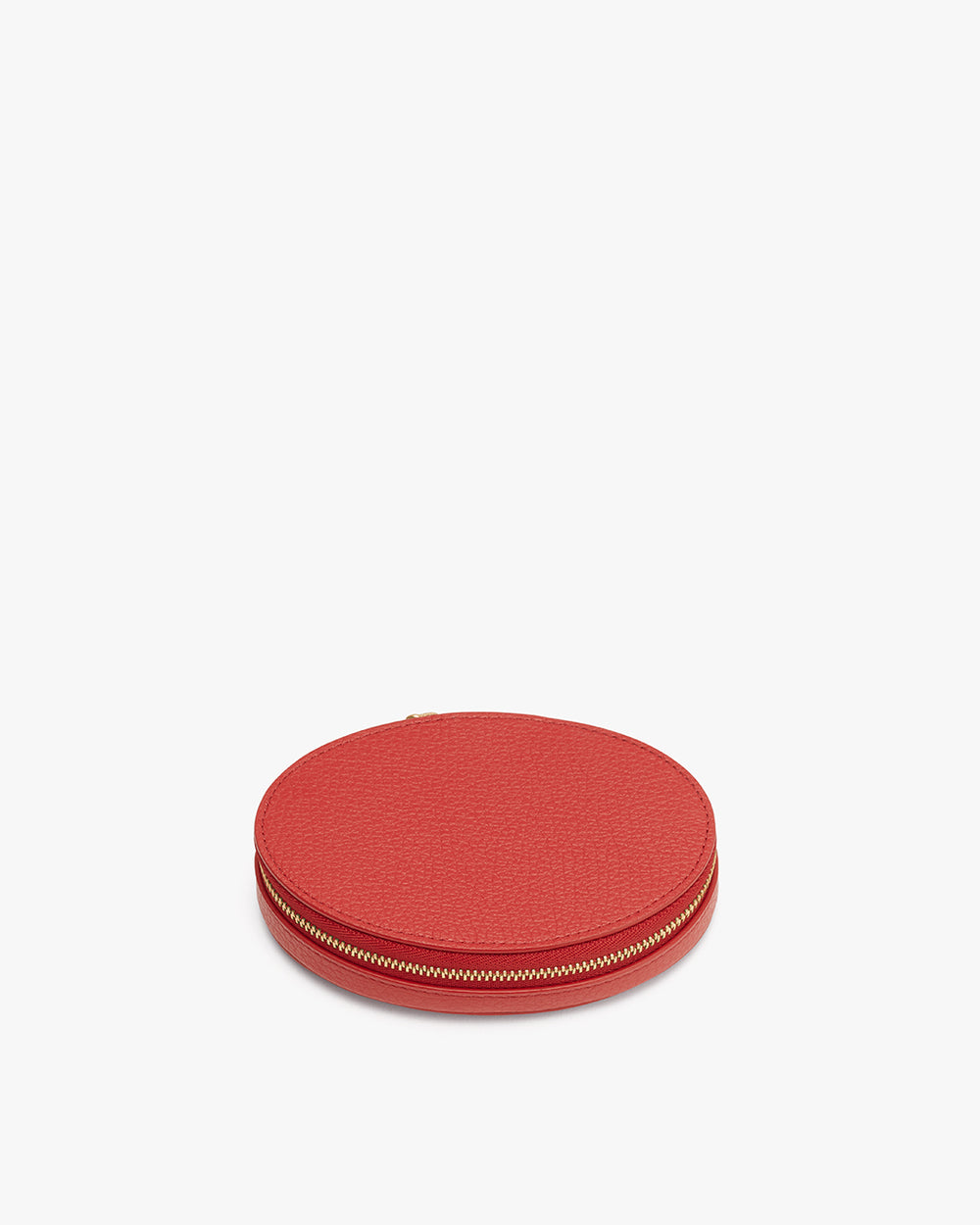 Round leather zippered pouch on a plain background.