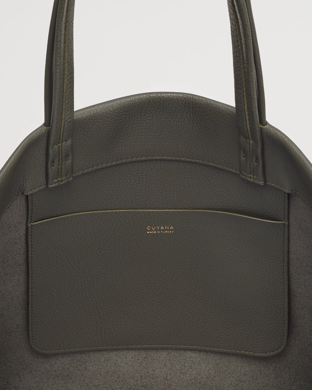 Handbag with two straps and a front pocket, branded logo visible.