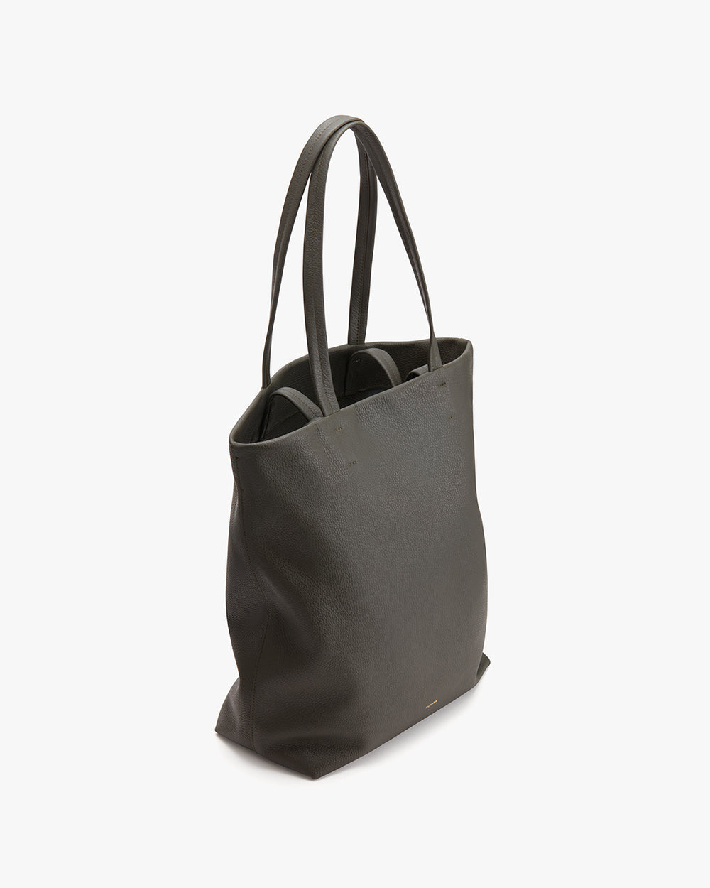 Tote bag standing upright on a solid surface.