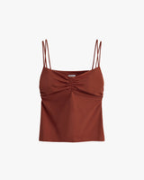 Spaghetti strap top with gathered detail at chest.