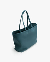 Large tote bag with double handles standing upright