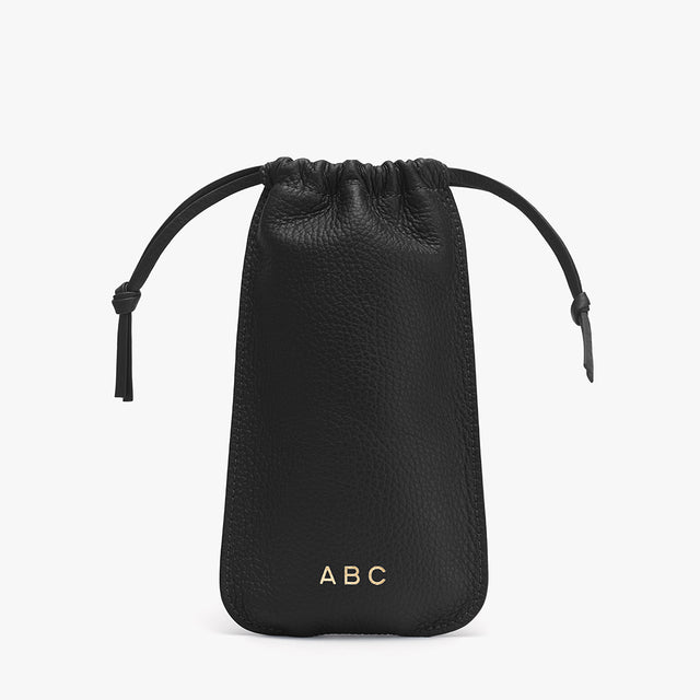 Small drawstring pouch with initials at the bottom center
