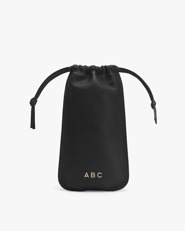 Small drawstring pouch with initials at the bottom center