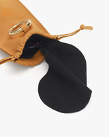 Travel bag with an open drawstring revealing a black interior flap