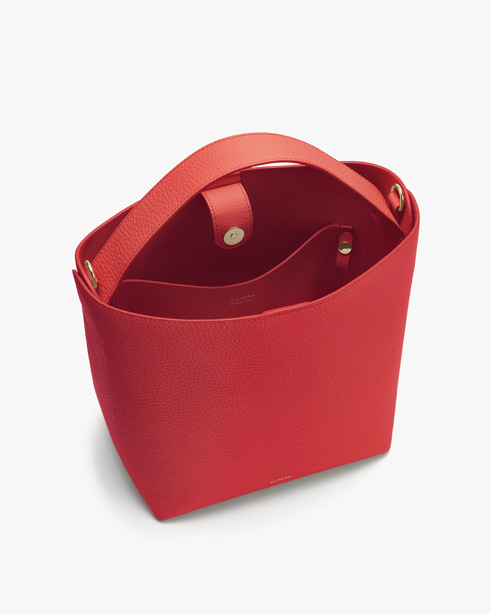 Red open handbag with interior pockets visible.