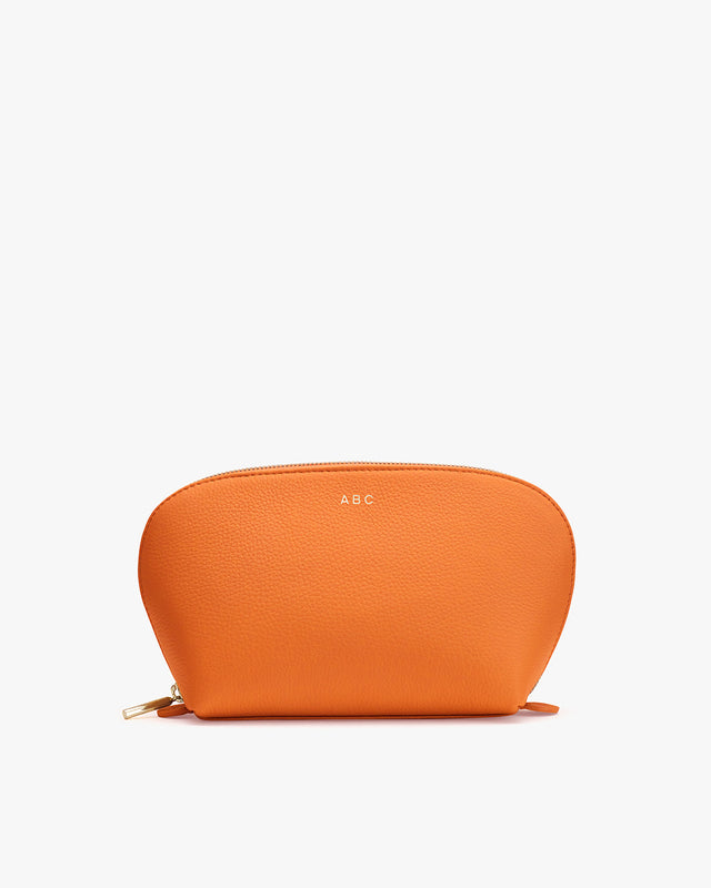 Pouch with a zipper on top, small letters on front.