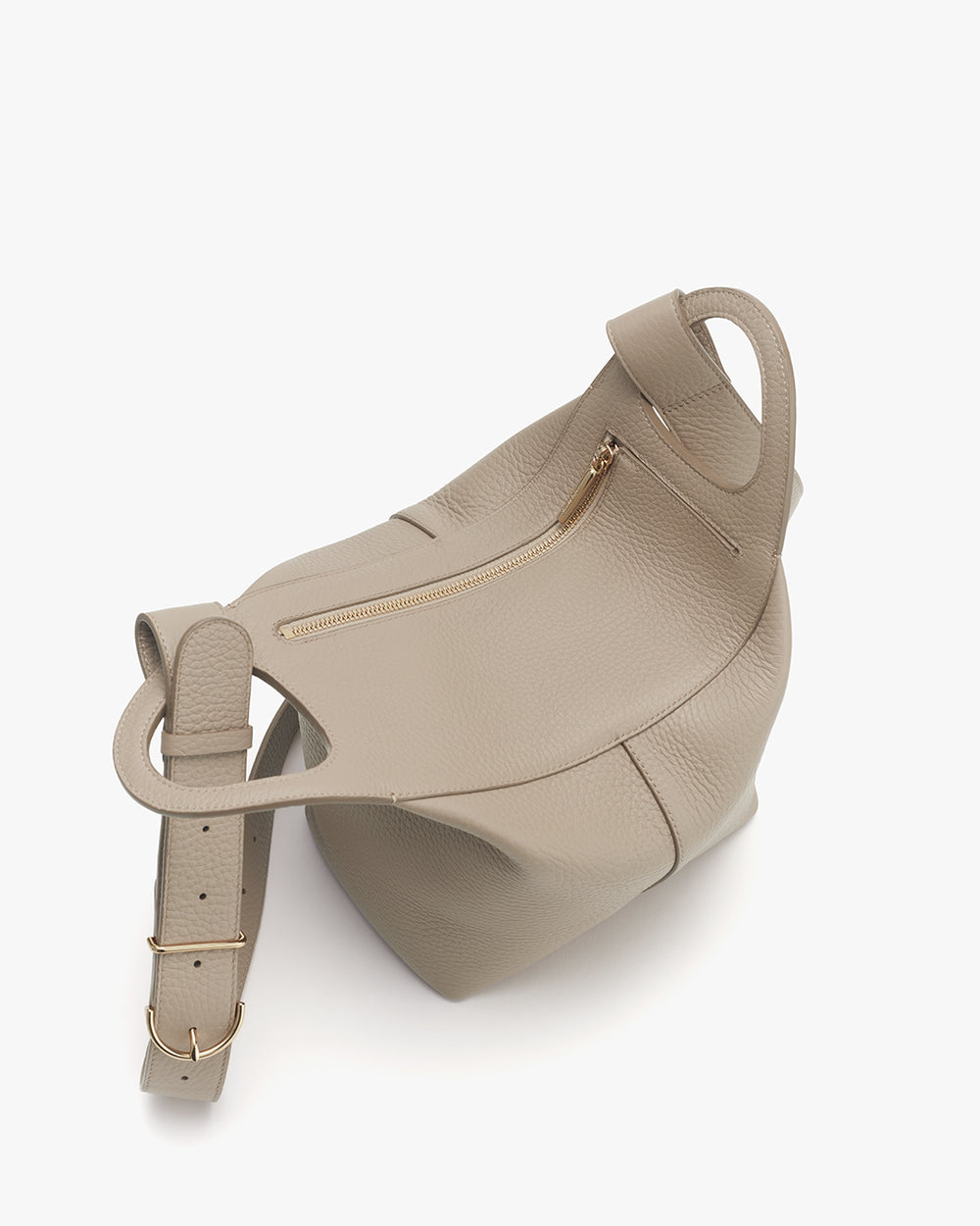 Bag with a strap and an opening, showcasing an exterior zipper pocket and buckle details.