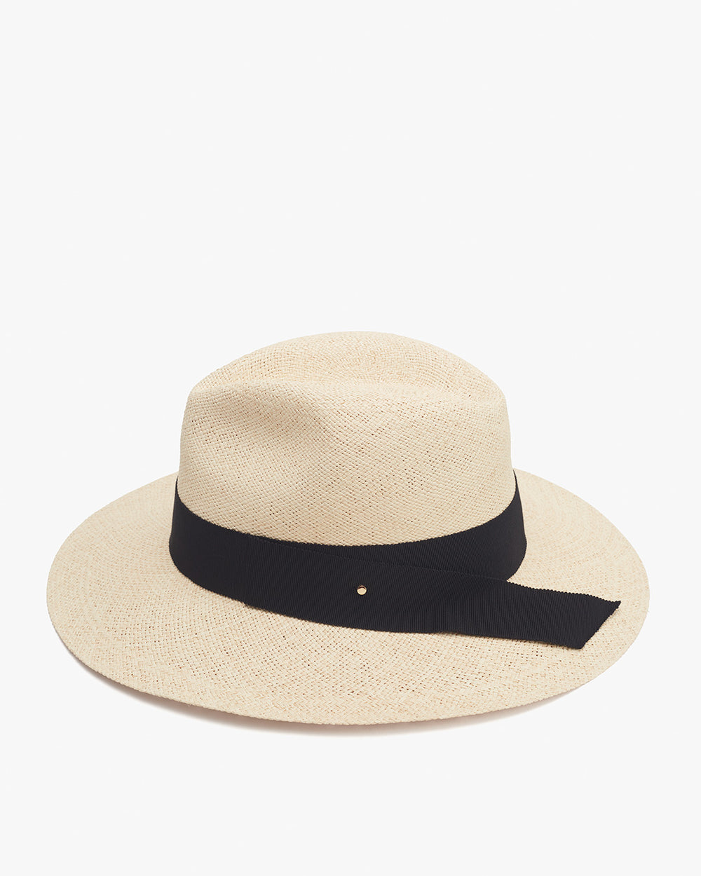 Straw hat with a black ribbon on a plain background.