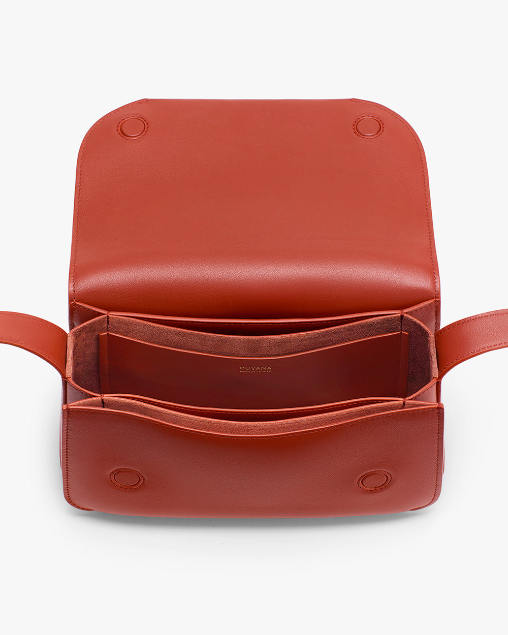 Open leather handbag showing interior compartments and stitching details.