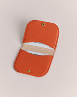 Small open cardholder with two compartments and a snap-button closure.