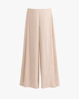 Wide-leg trousers on a plain background.