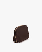 Rounded pouch with a zipper on top.