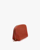 Zippered pouch standing upright.