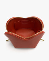 Open zippered pouch with exposed interior pocket
