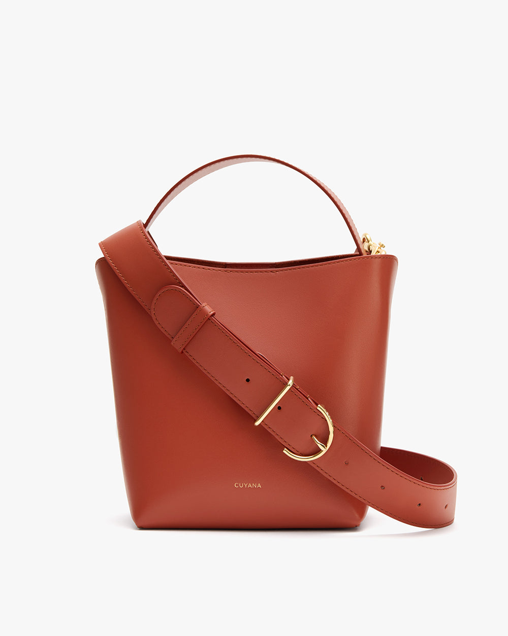 Bucket bag with thick strap and gold buckle.