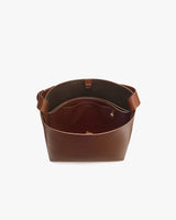Open bag with wide handle and interior pocket.