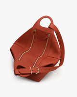 Bag with a strap and two vertical zippers on the top.