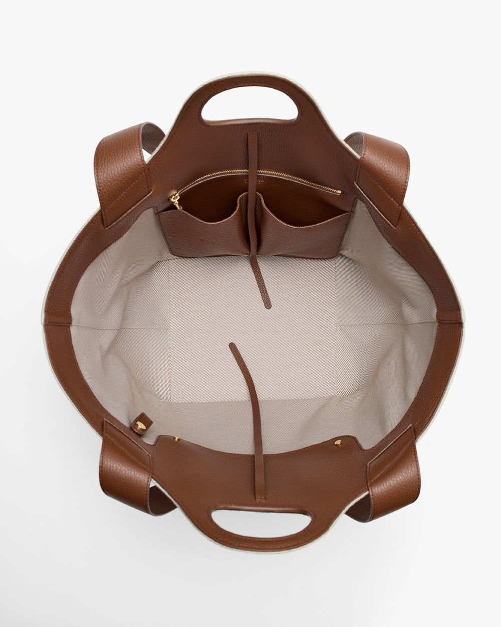 Top view of an open tote bag showing internal compartments and pockets.