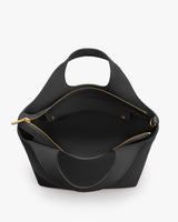 Open handbag with visible inner pocket and two small handles