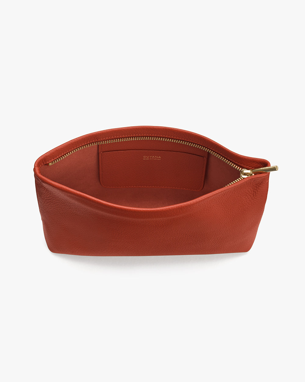 Open leather pouch with visible zipper and interior label.