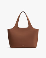 Tote bag with two handles on a plain background.