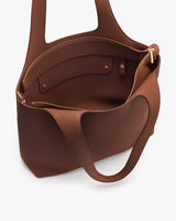 Open tote bag with visible interior pockets and zip closure