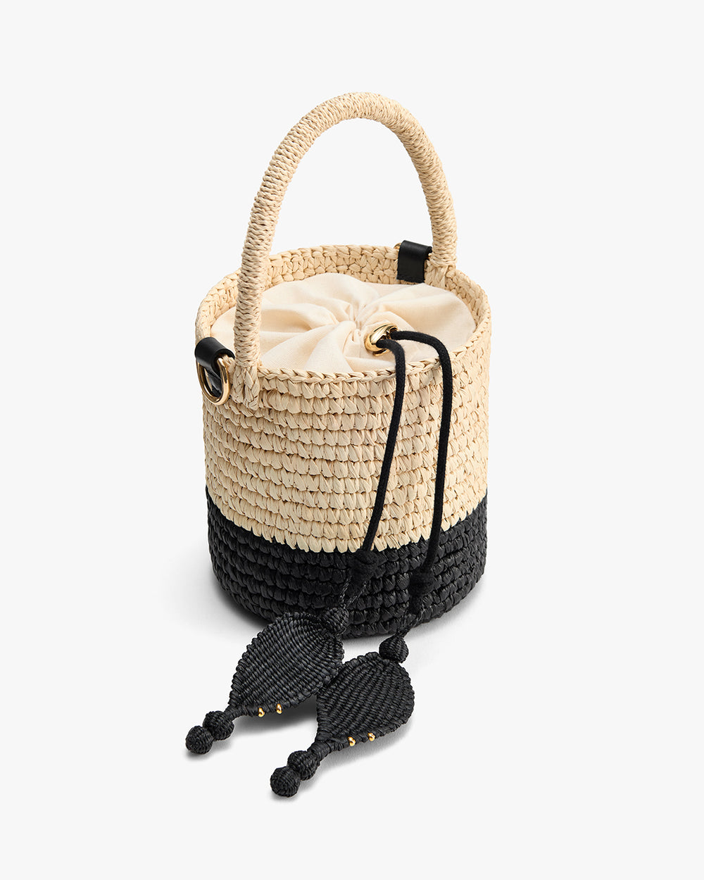 Woven bucket bag with drawstring closure and decorative tassels.