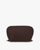 Pouch with zipper on top against plain background.