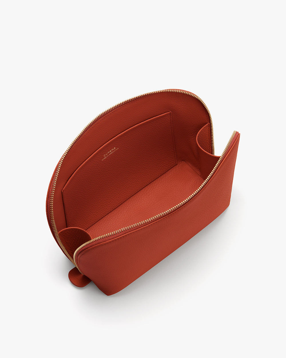 Open leather pouch with a zipper and inner pocket.