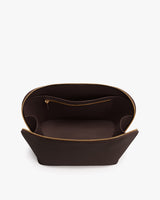 Open travel bag with interior zip pocket and wide opening.