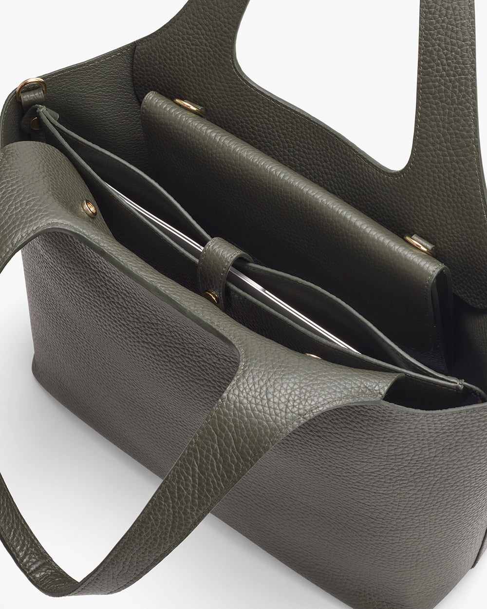 Top view of an open handbag with visible handles and compartments.