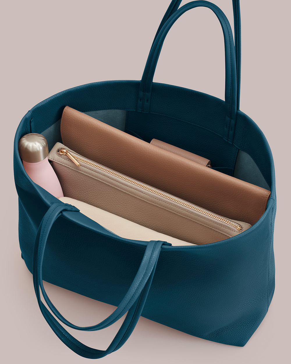 Open tote bag with water bottle, wallet, and pouch inside.