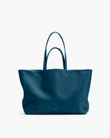 A large tote bag with double handles displayed upright.