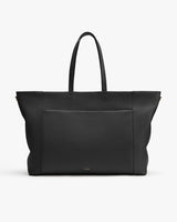 Large tote bag with long handles and front pocket.