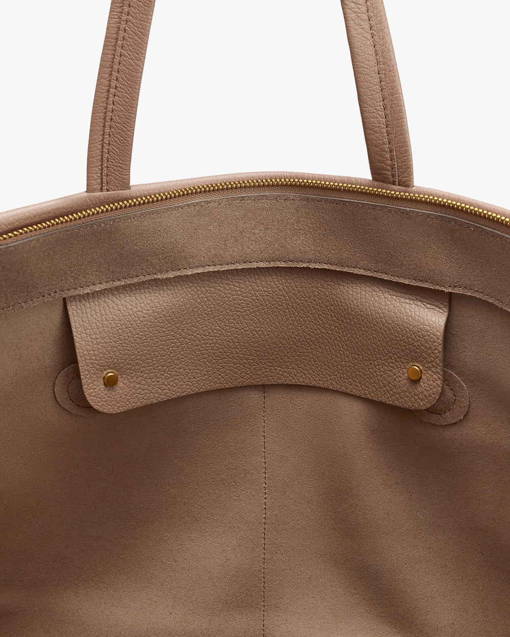 Open travel bag with zipper and handle visible