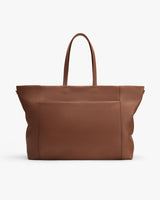 Large travel bag with two handles and front pocket.