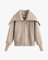 Jacket with large collar and zip closure on white background.