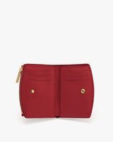 Open wallet with multiple card slots and zipper section.