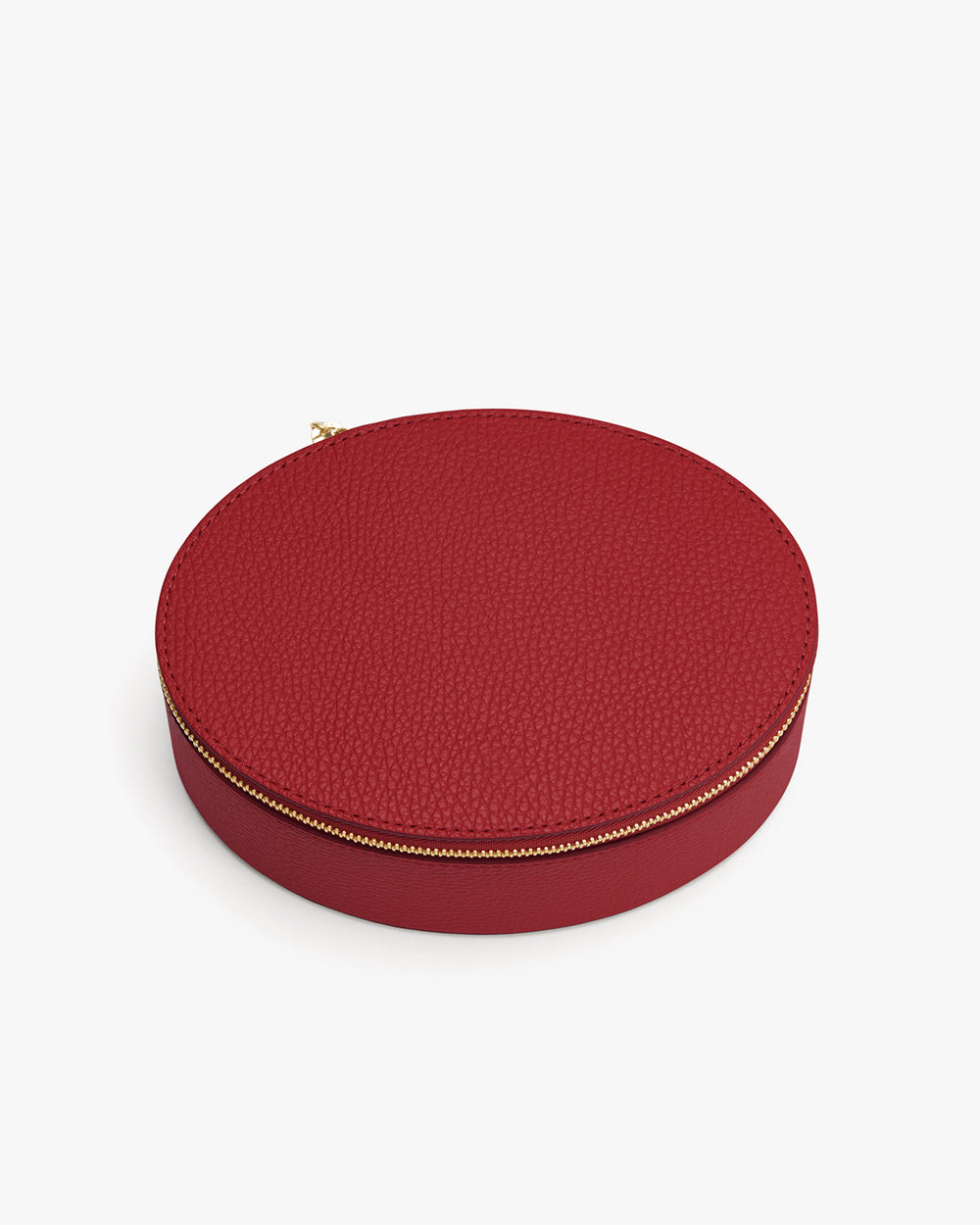 Round textured case with zipper closure.