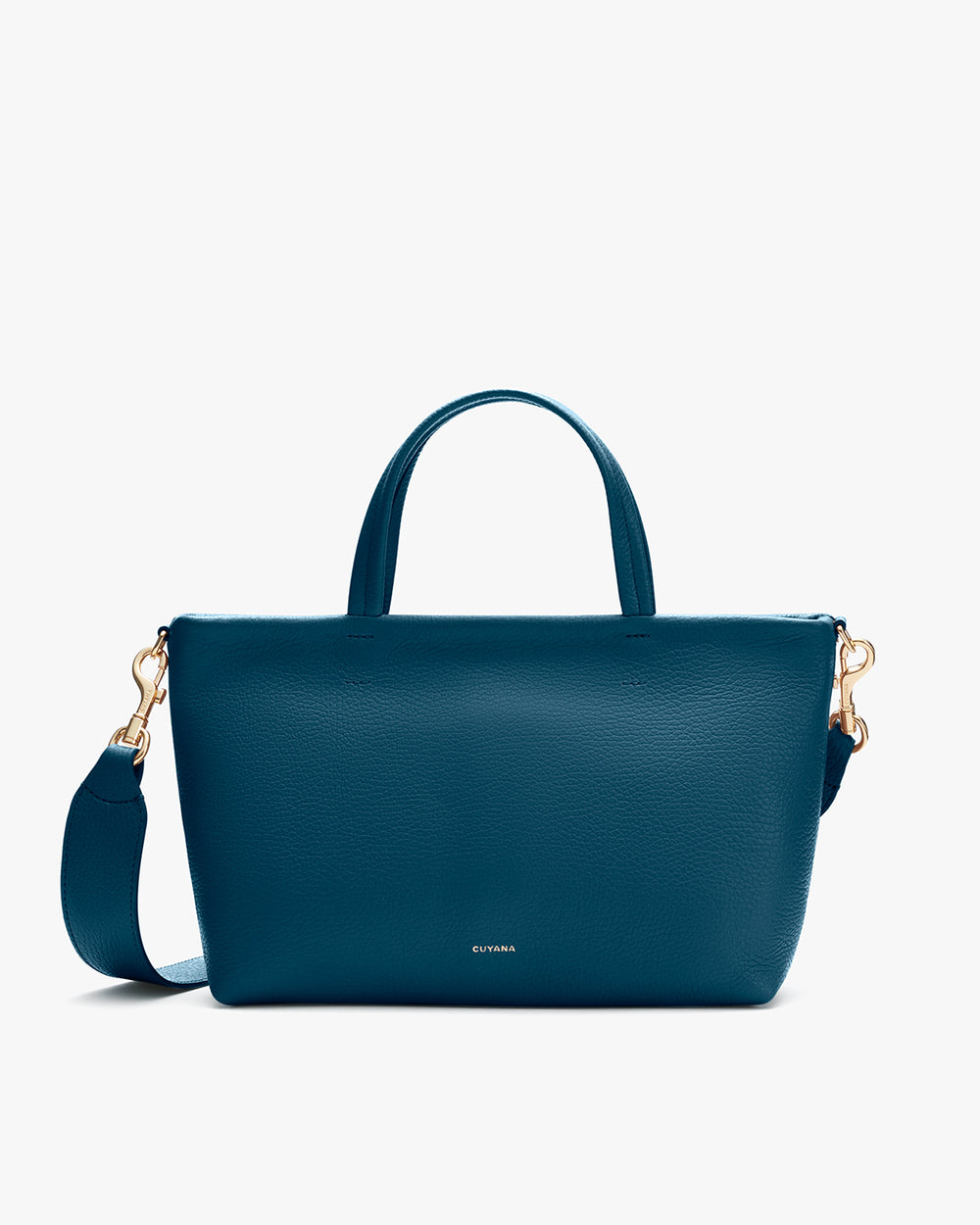 Handbag with top handles and detachable shoulder strap on a plain background.