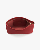 Open zippered pouch with visible interior and a brand logo inside.