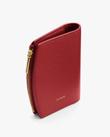 Slim wallet with a zippered edge and a small brand logo.