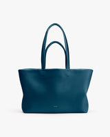 Tote bag with two handles on plain background.