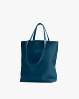 Tote bag with dual handles on a plain background.