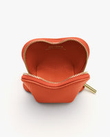 Small open pouch with a zipper and brand name inside.