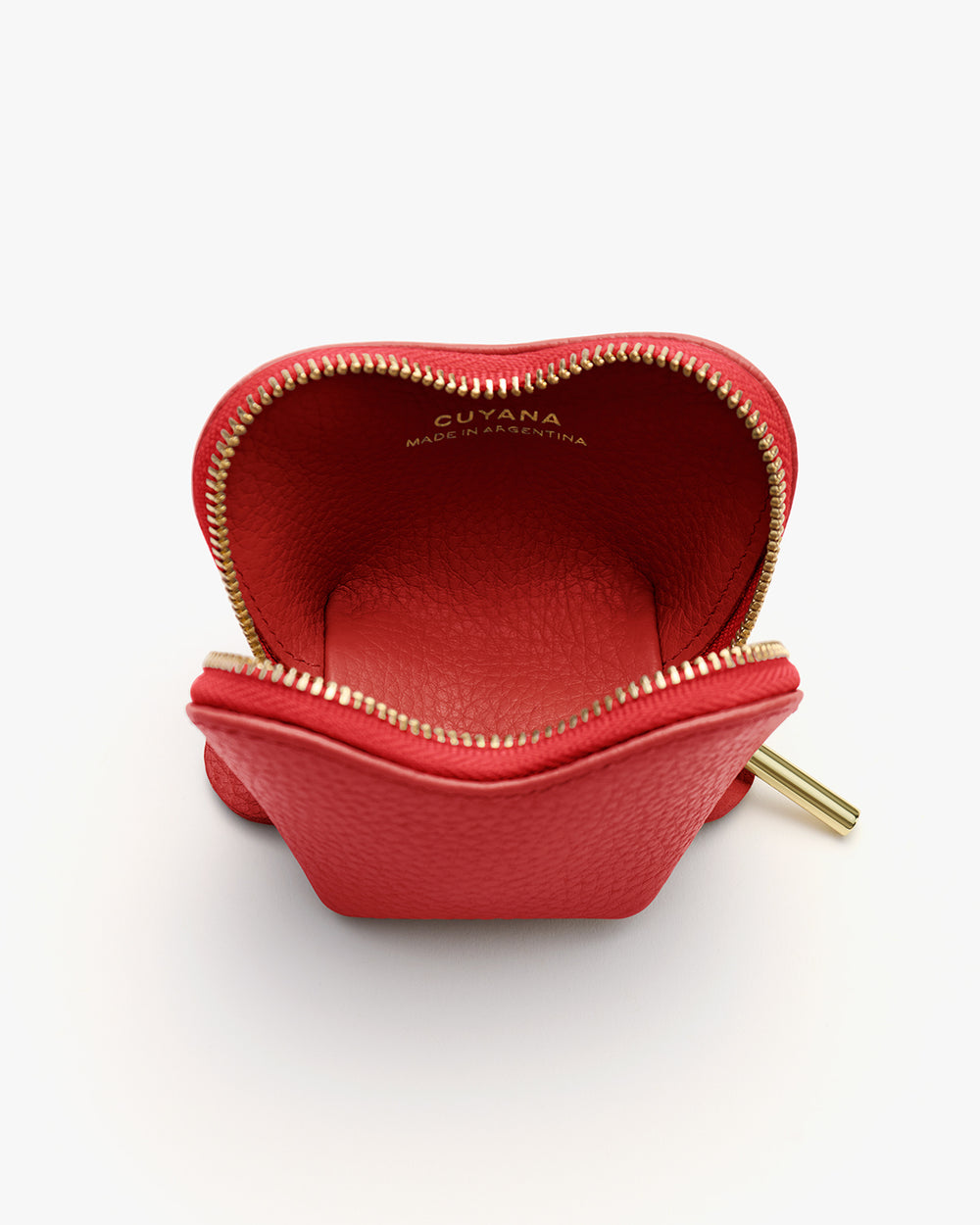 Small leather pouch with open zipper and visible branding inside.