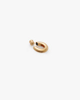 Small, smooth hoop earring with a round stud.